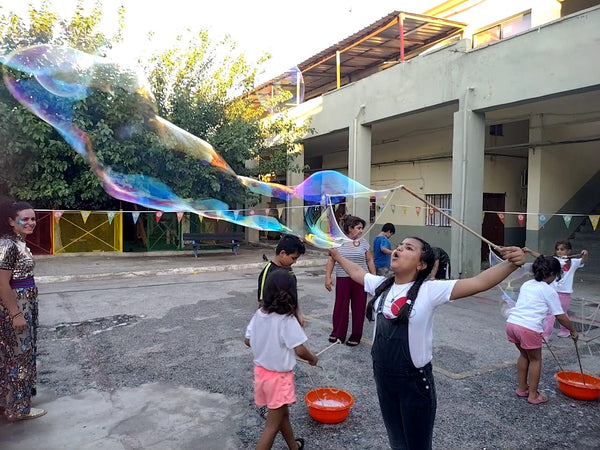 Bubbles and Smiles in a Refugee Camp in Athens