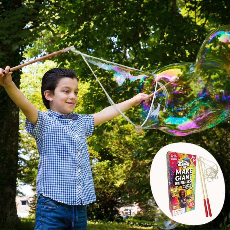 A child making an enormous bubble with Dr Zigs wooden wands