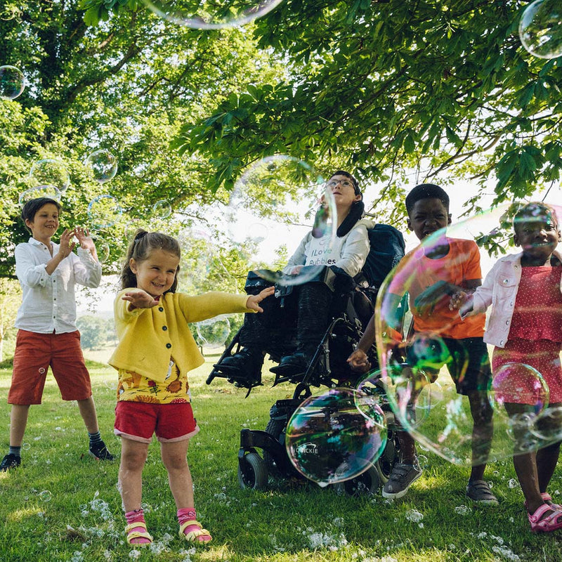 Children playing together with Dr Zigs giant bubbles